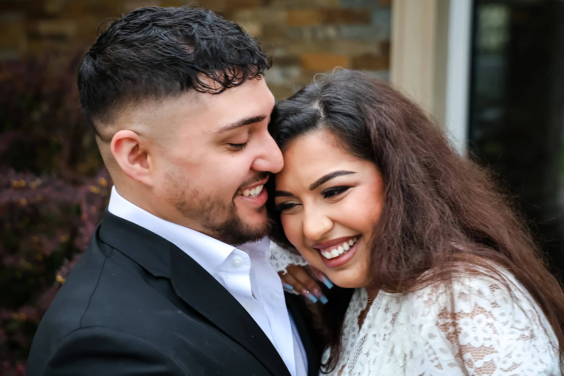Newlyweds smiling together on their wedding day
