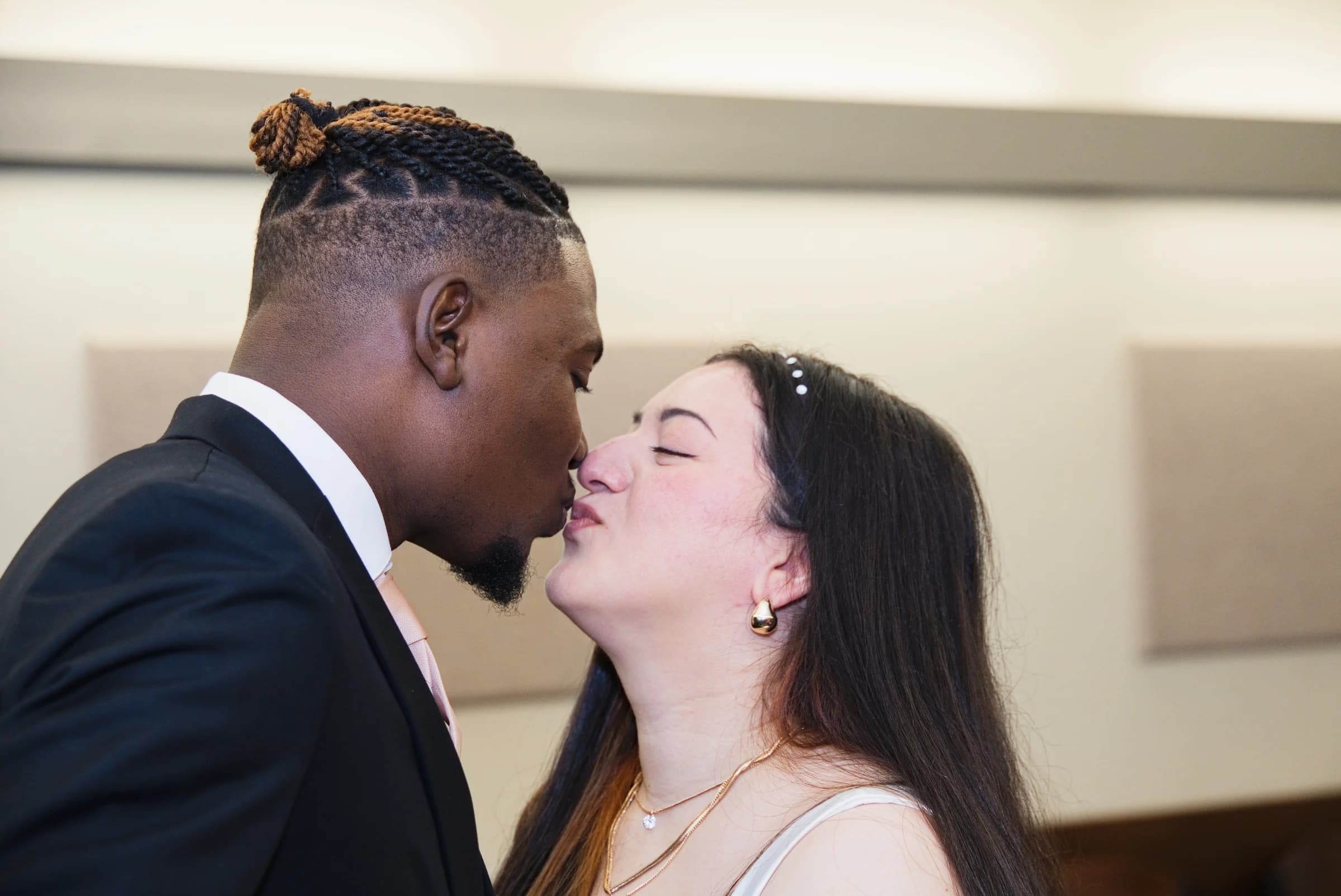Newlyweds sharing a kiss at their wedding